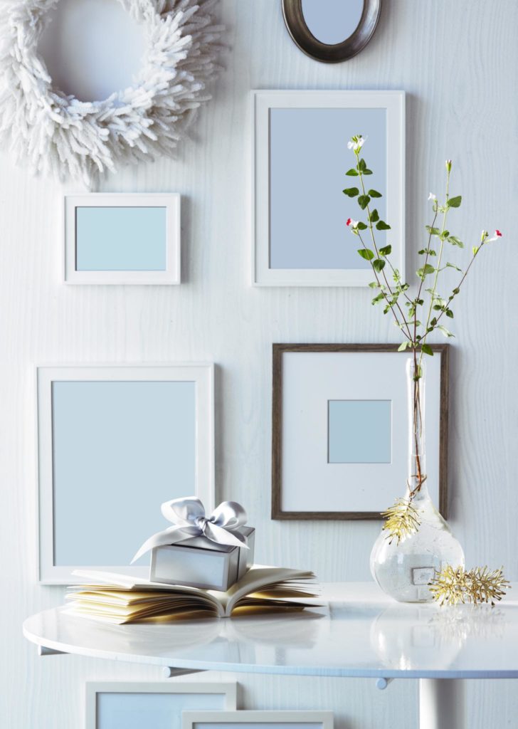 Frames on Wall with Present on Table